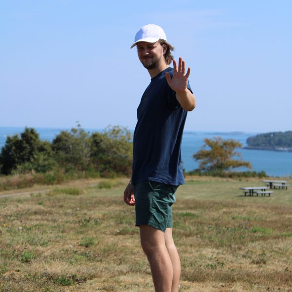 Thor waving from a bluff above Puget Sound